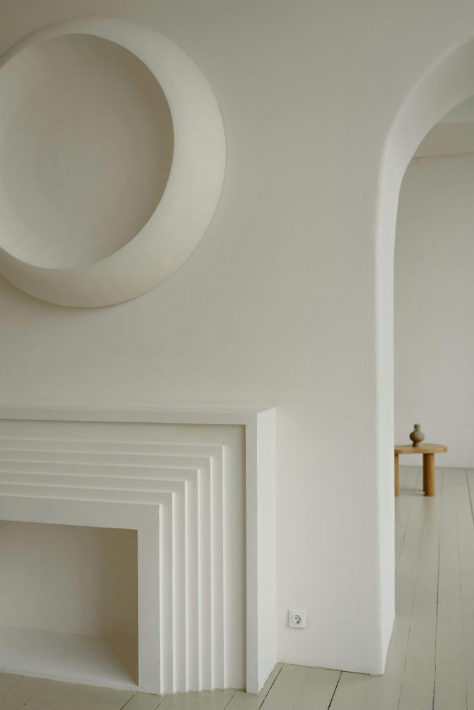 Elegant minimalist interior featuring modern geometric wall art and soft neutral tones.